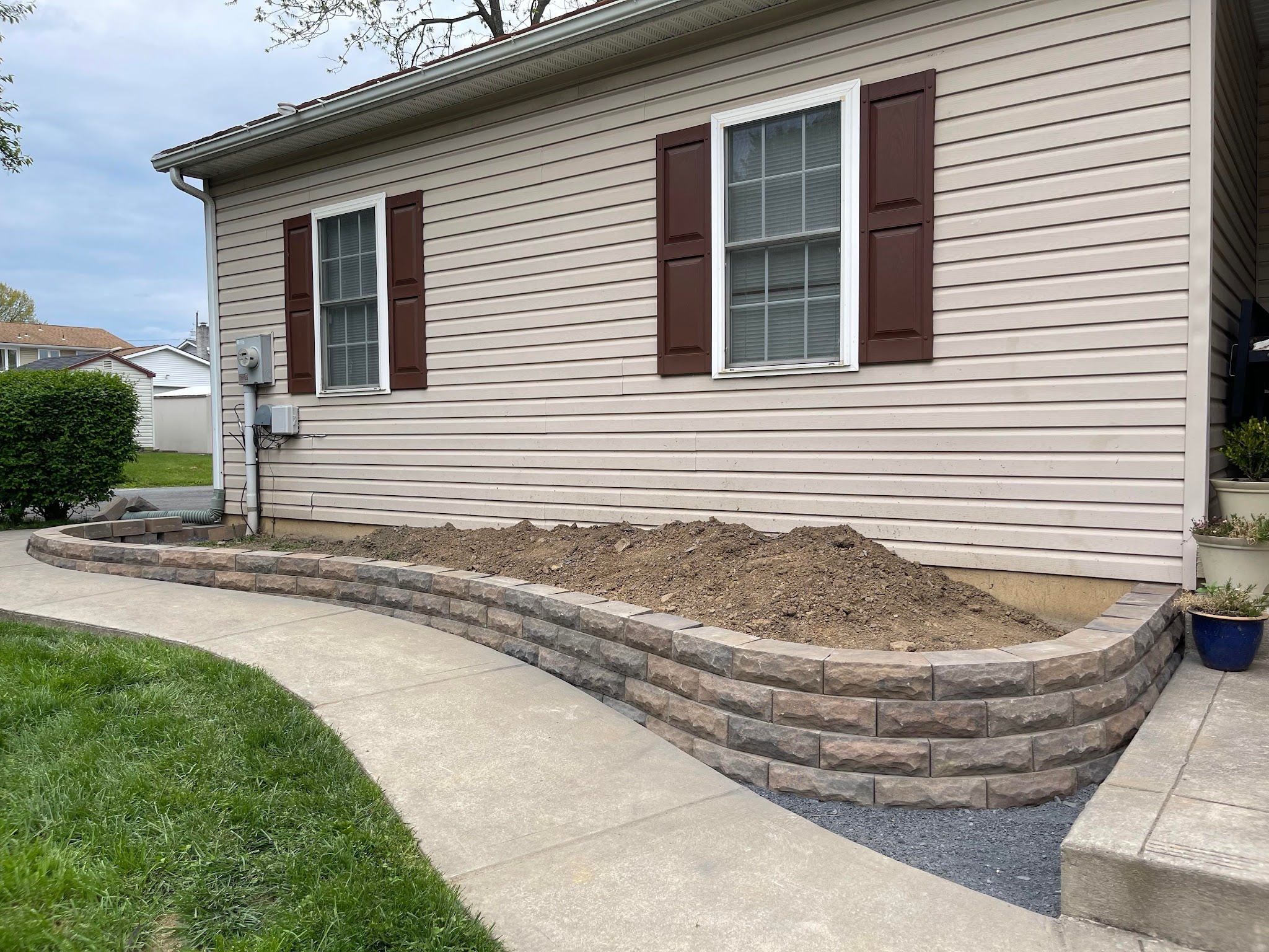 Retaining wall with soil preparation for garden bed